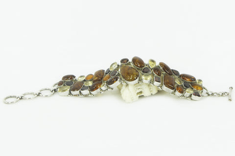"FLAMING AMBER" amber, garnet and yellow topaz silver bracelet.