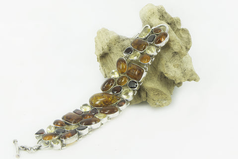 "FLAMING AMBER" amber, garnet and yellow topaz silver bracelet.