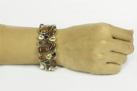 "FLAMING AMBER" amber, garnet and yellow topaz silver bracelet.
