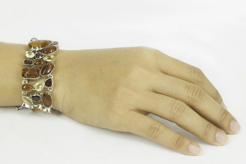 "FLAMING AMBER" amber, garnet and yellow topaz silver bracelet.