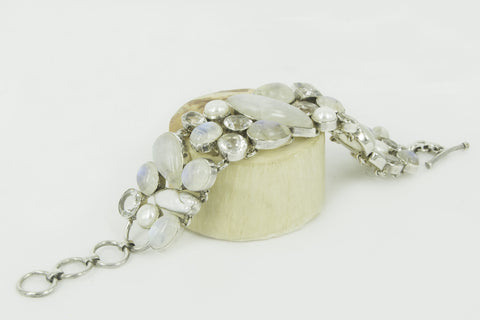 “TENDER LIGHTNING” rainbow moonstone, blue topaz, crystal quarts and pearls silver bracelet.
