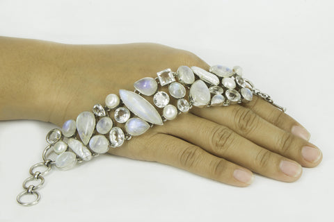 “TENDER LIGHTNING” rainbow moonstone, blue topaz, crystal quarts and pearls silver bracelet.