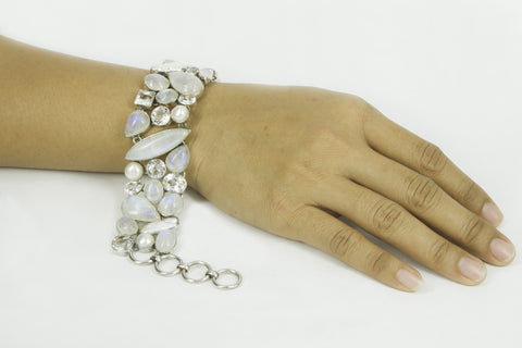 “TENDER LIGHTNING” rainbow moonstone, blue topaz, crystal quarts and pearls silver bracelet.